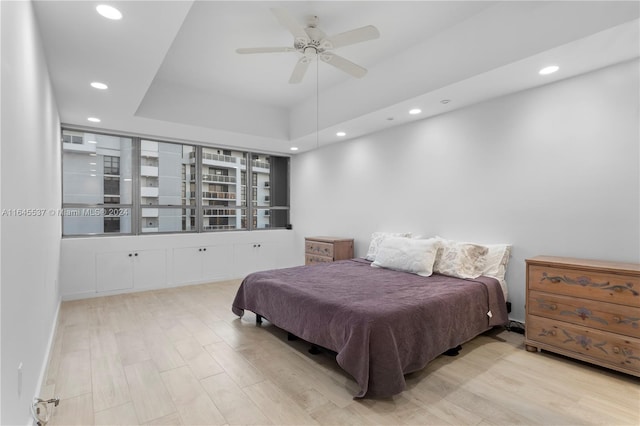 bedroom with light wood-type flooring and ceiling fan