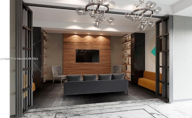 living room featuring wood walls, wood-type flooring, and a notable chandelier