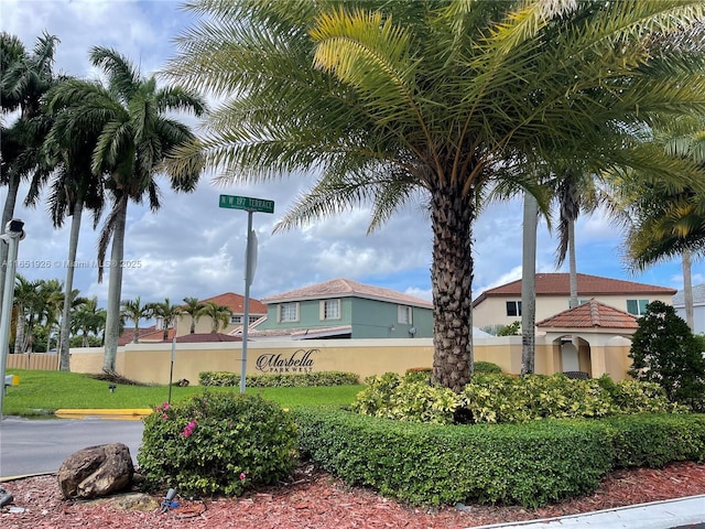 view of property with fence