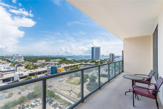 balcony featuring a water view