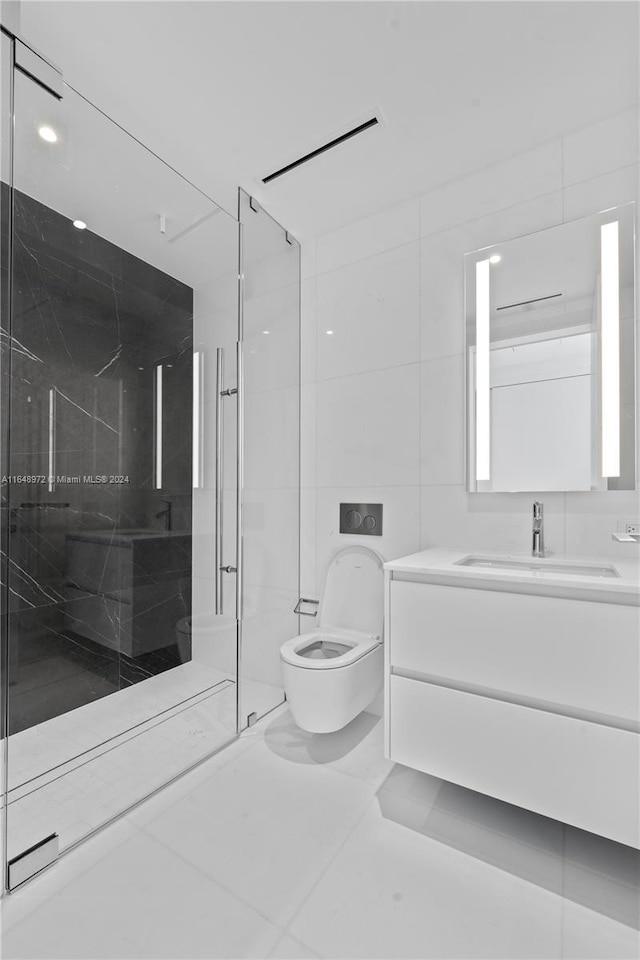 bathroom featuring an enclosed shower, tile patterned floors, toilet, tile walls, and vanity