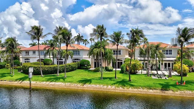 exterior space with a yard and a water view