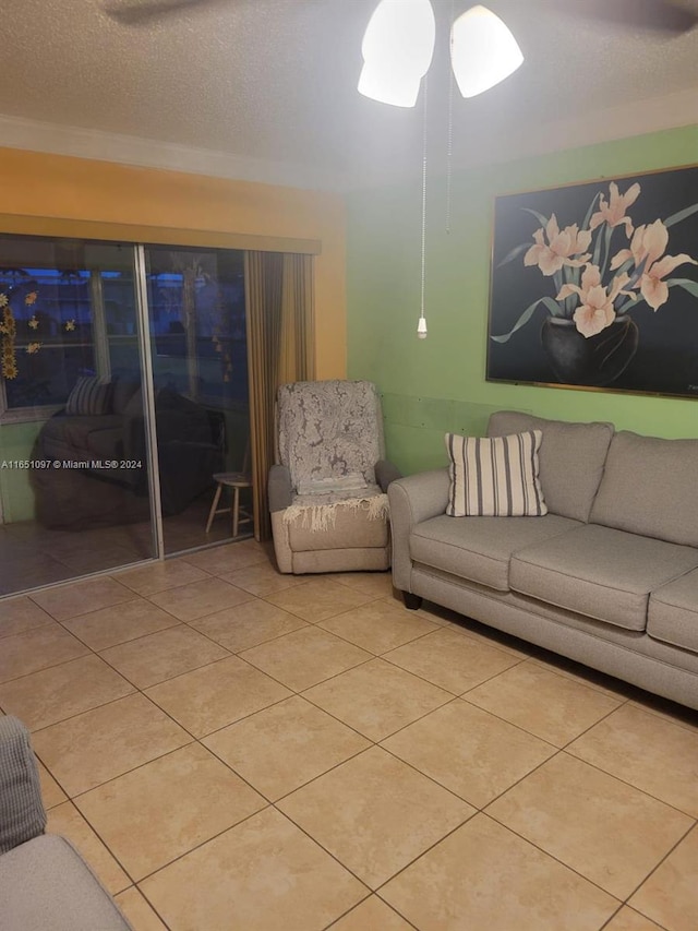 tiled living room featuring a textured ceiling