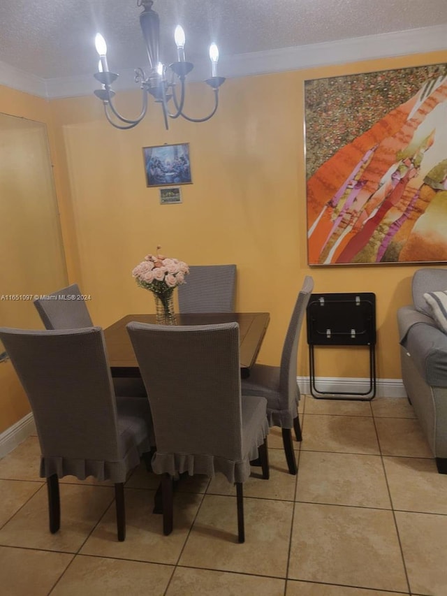 dining space with light tile patterned floors, a chandelier, crown molding, and a textured ceiling