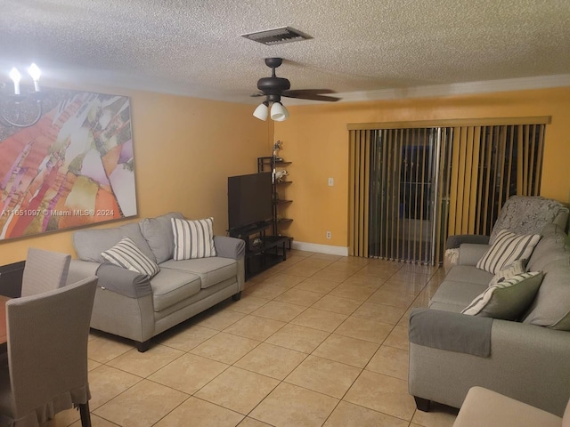 tiled living room with a textured ceiling and ceiling fan