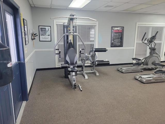 exercise room featuring a paneled ceiling