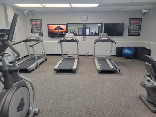 exercise room with a drop ceiling