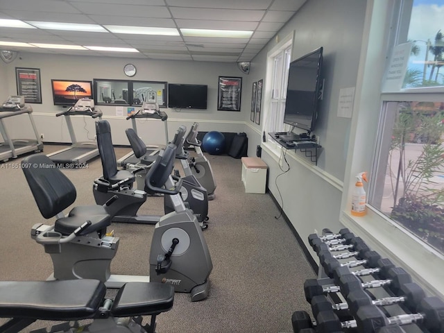 workout area featuring a paneled ceiling