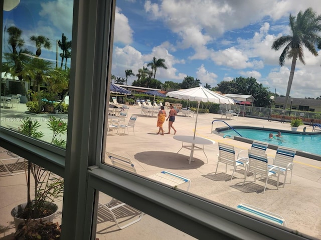 view of swimming pool with a patio area