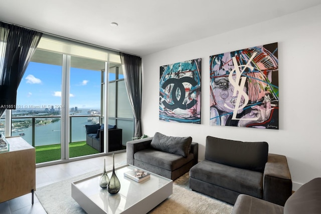 living room with a water view and light tile patterned floors