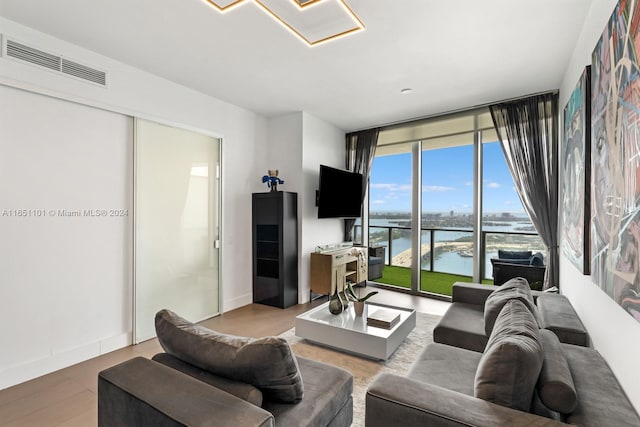 1100 Biscayne Blvd Unit 4004, Miami, FL 33132 - living room featuring baseboards, visible vents, and a wall of windows