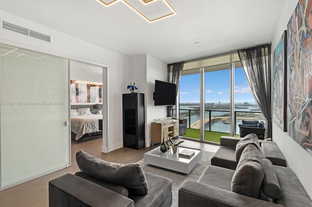 living room featuring floor to ceiling windows