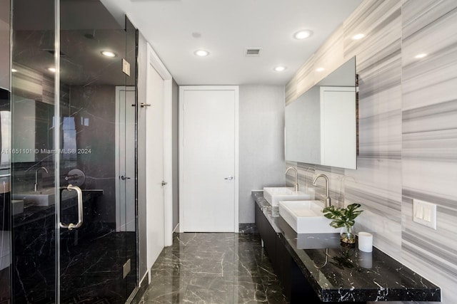 bathroom featuring walk in shower and vanity