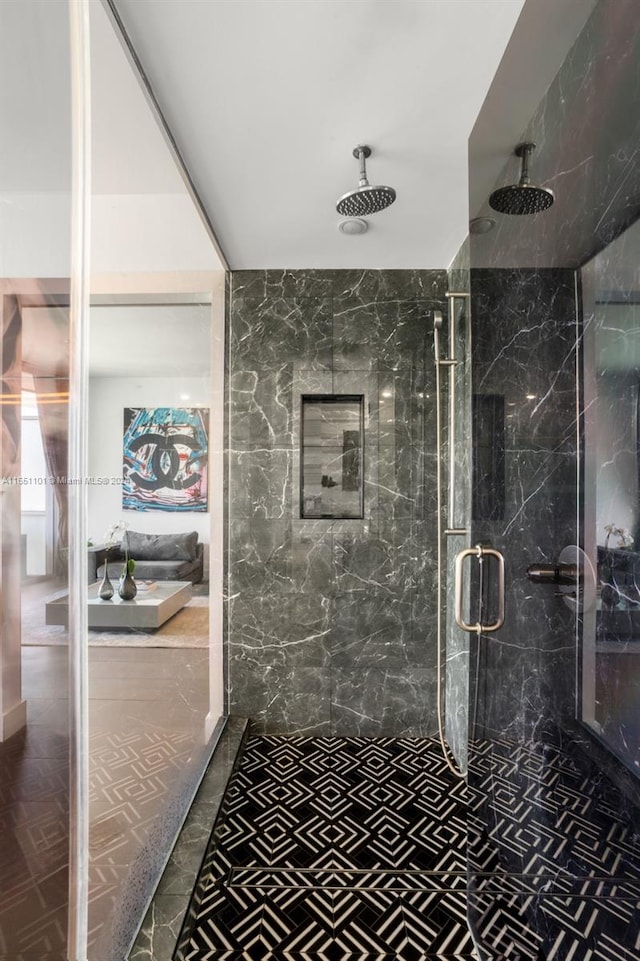 bathroom featuring tile patterned flooring and an enclosed shower