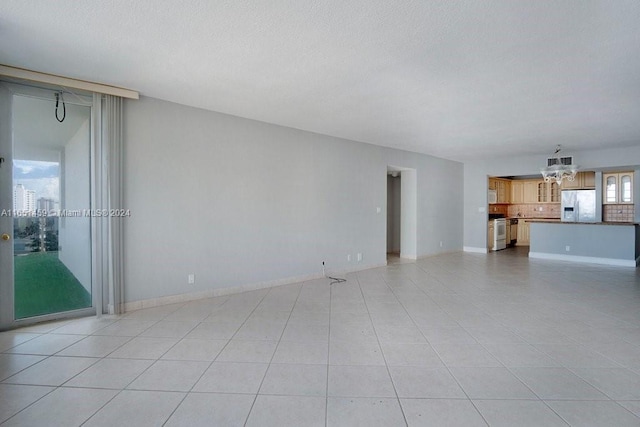 unfurnished living room featuring light tile patterned floors