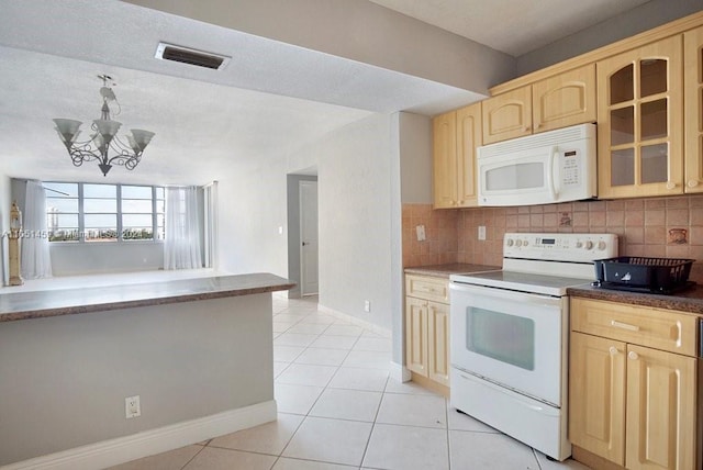 kitchen featuring an inviting chandelier, white appliances, light tile patterned floors, backsplash, and light brown cabinets