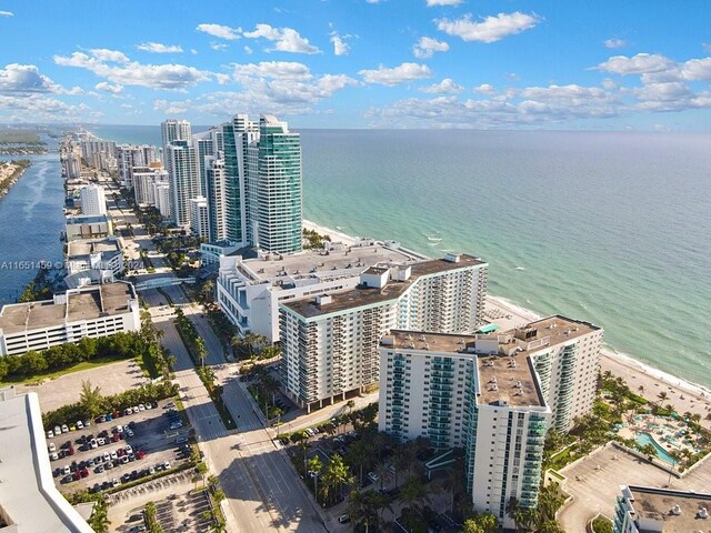 bird's eye view with a beach view and a water view