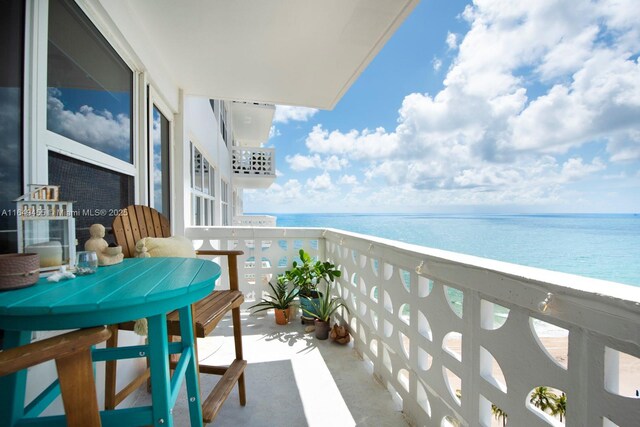 balcony featuring a water view