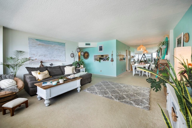 carpeted living room featuring a textured ceiling