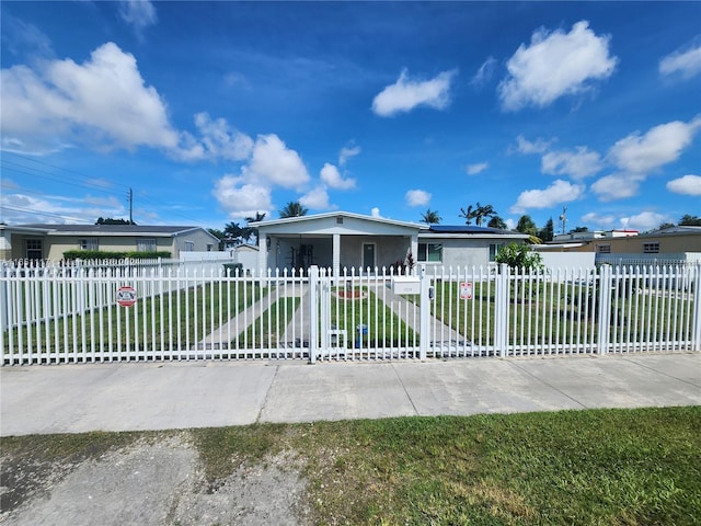 single story home featuring a front yard