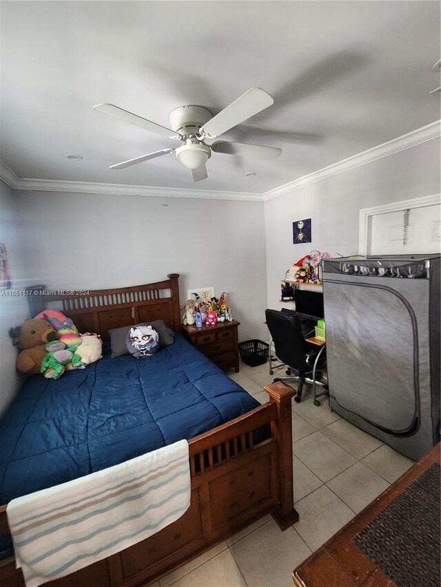 tiled bedroom with crown molding and ceiling fan