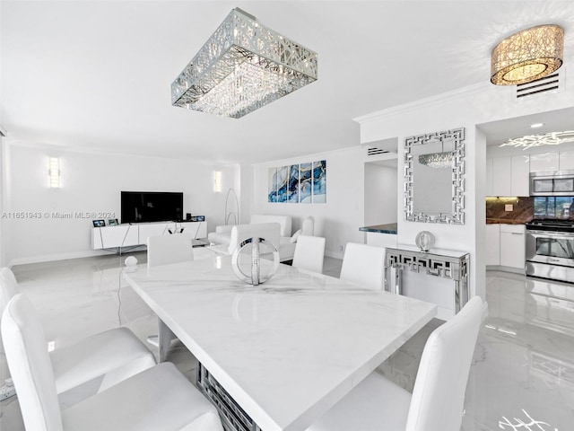 dining space with crown molding