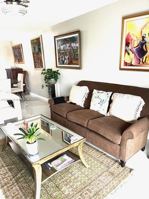 6100 NW 44th St Unit 405, Lauderhill, FL 33319 - living room featuring baseboards