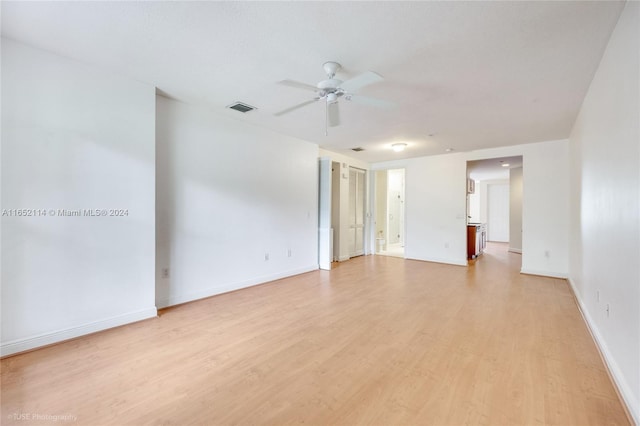 spare room featuring light hardwood / wood-style flooring and ceiling fan