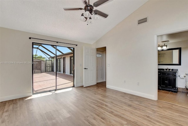 unfurnished room featuring ceiling fan, wood-type flooring, and a textured ceiling