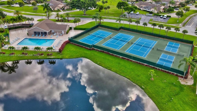 birds eye view of property with a water view