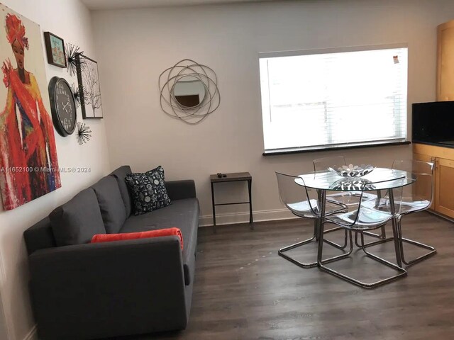 living room featuring dark wood-type flooring