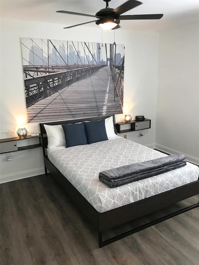 bedroom featuring dark wood-type flooring and ceiling fan