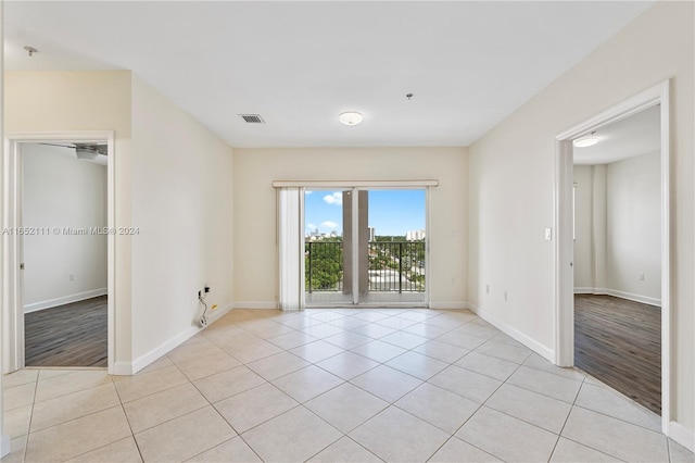 unfurnished room with light wood-type flooring