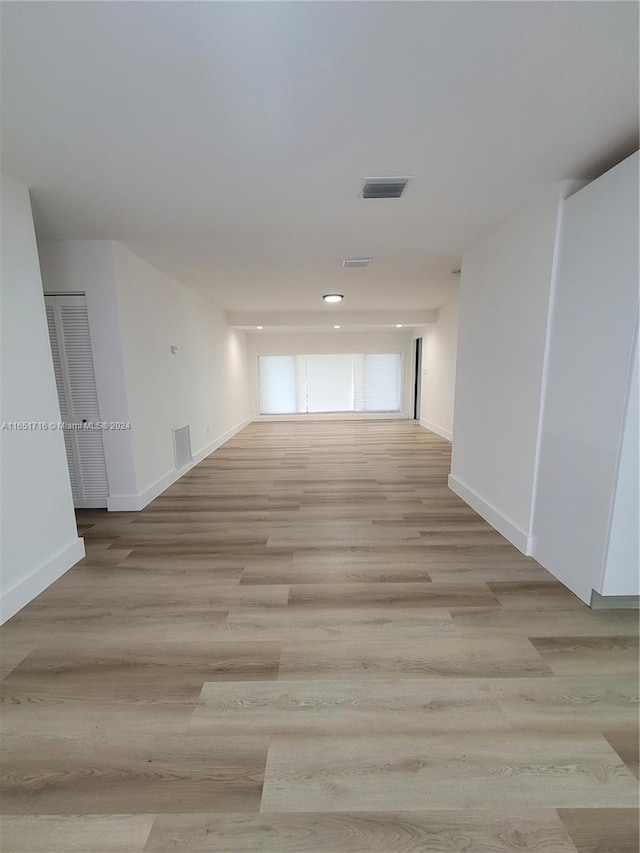 hall with light hardwood / wood-style flooring