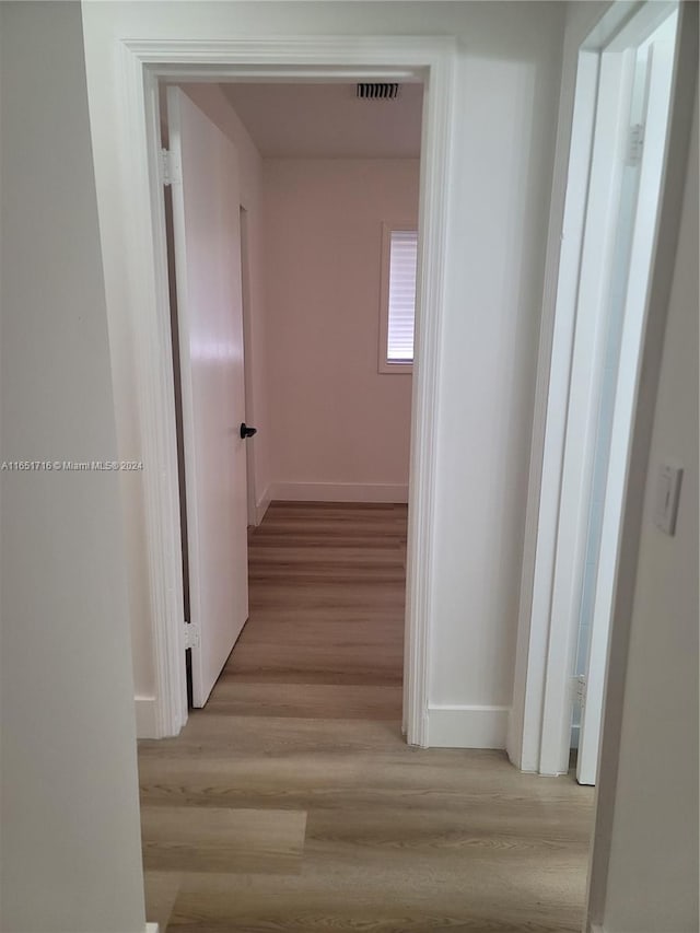 corridor featuring light hardwood / wood-style flooring