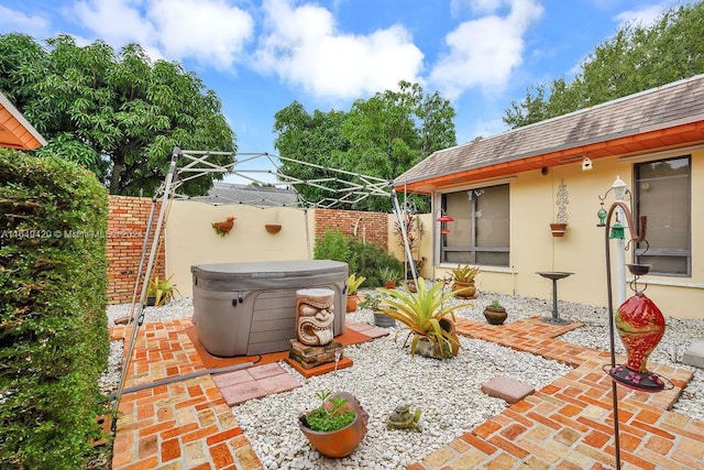 view of patio with a hot tub