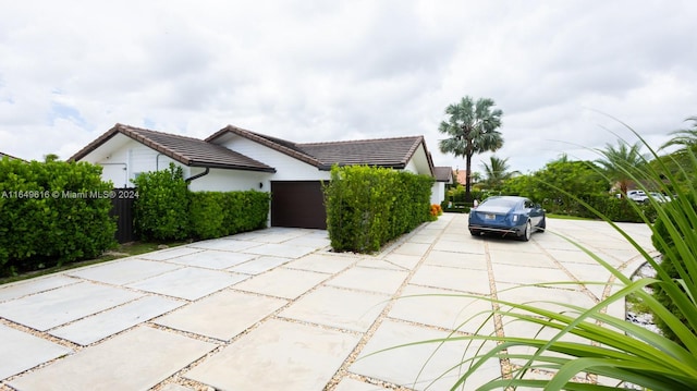 view of side of property with a garage