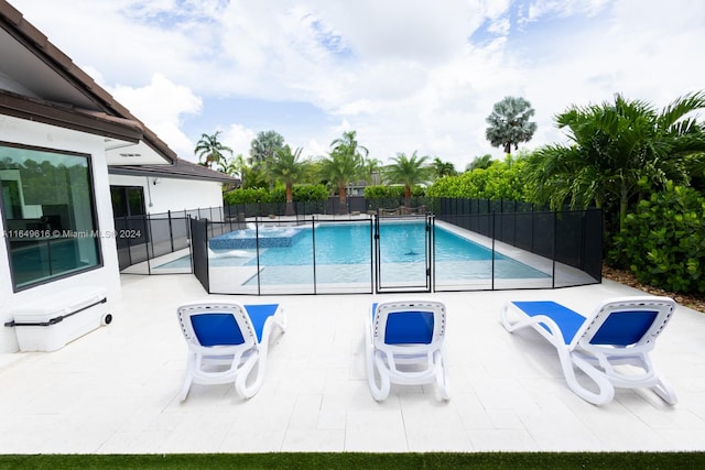 view of swimming pool featuring a patio area