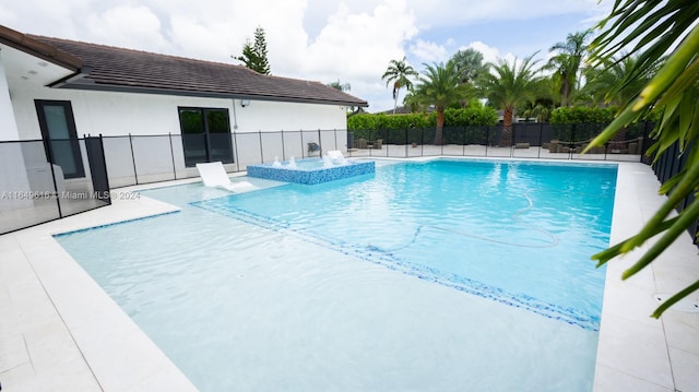 view of swimming pool with a patio