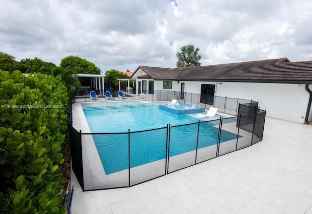 view of swimming pool featuring a patio area