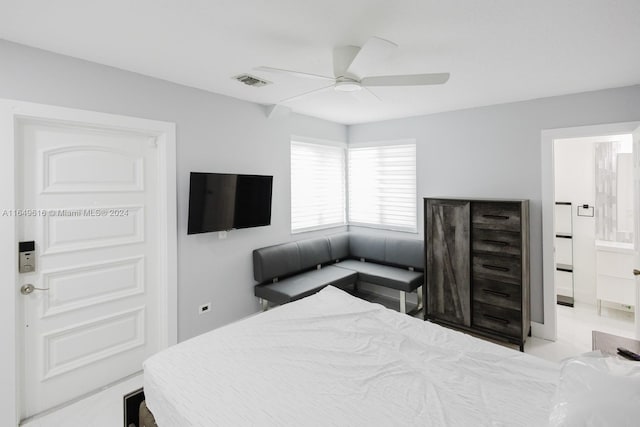 bedroom featuring ceiling fan and ensuite bathroom