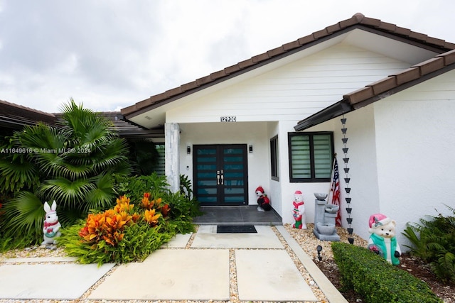 entrance to property featuring french doors