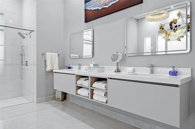 bathroom featuring vanity, a healthy amount of sunlight, and an enclosed shower