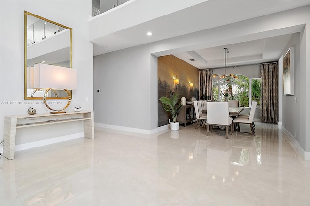 dining room with a raised ceiling