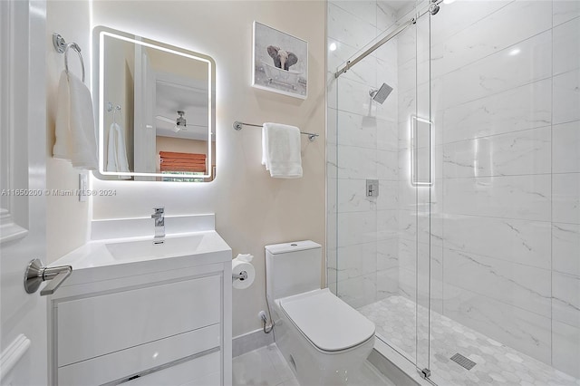 bathroom with vanity, toilet, walk in shower, and ceiling fan