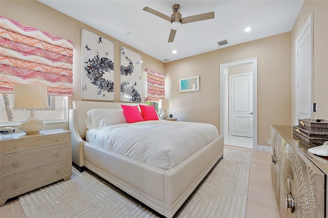 bedroom featuring light hardwood / wood-style flooring and ceiling fan