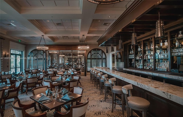 interior space featuring ornamental molding, beamed ceiling, and coffered ceiling