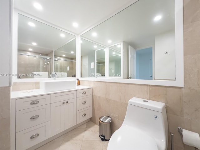 bathroom featuring a stall shower, tile walls, and marble finish floor