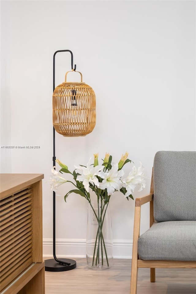 interior details featuring baseboards and wood finished floors
