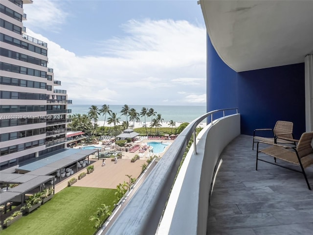 balcony featuring a water view